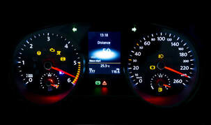 Warning lights on dashboard of broken down car